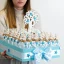 Torta di Bomboniere per battesimo maschio con 40 barattolini