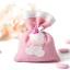 Sacchettino Portaconfetti rosa con orsetto e sonagli in Offerta