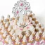 Torta di Bomboniere per battesimo bimba con 40 barattolini