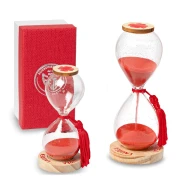 Bomboniere 2026 Linea Laurea Clessidre in vetro con nappina rossa e base in legno